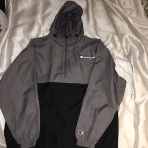 Black and gray champion wind breaker.